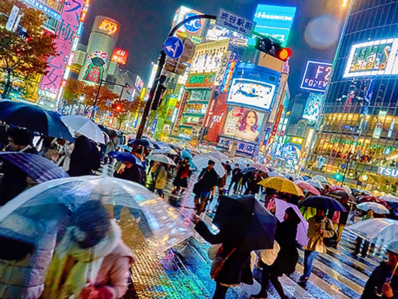 people in a rain storm in Japan