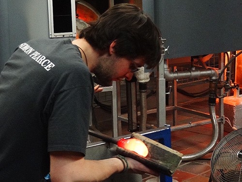 A glassblower at Simon Pearce