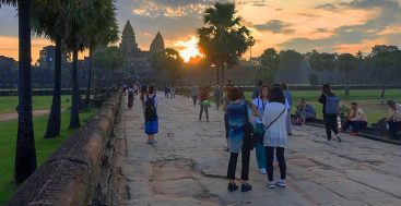 people looking at a sunrise in Angkor