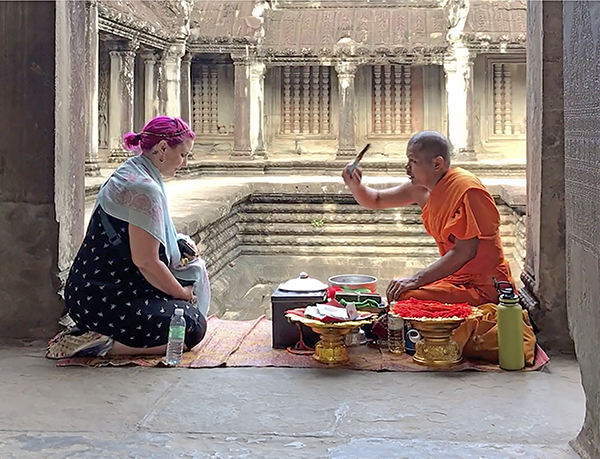 Foto Friday - a Buddist monk blessing a woman with purple hair