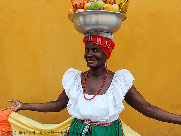 Foto Friday - woman with a basket of fruit on her head