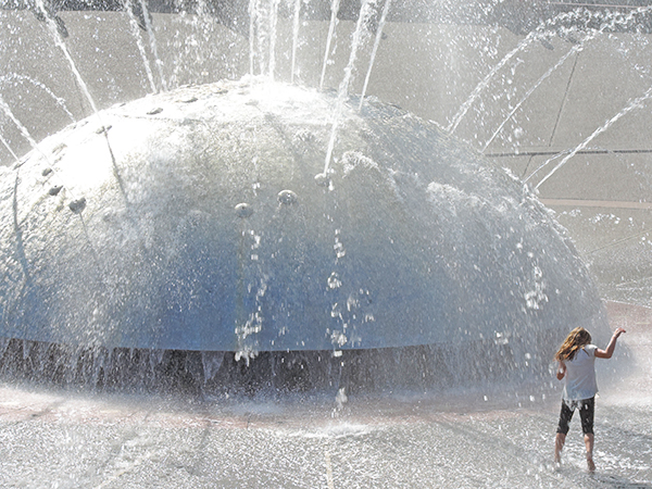 Foto Friday - a little girl getting wet by a fountain
