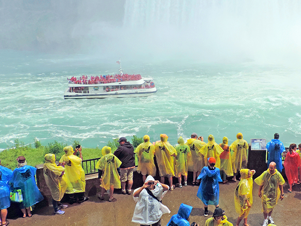 Foto Friday - people watching a tour boat under a large waterfall