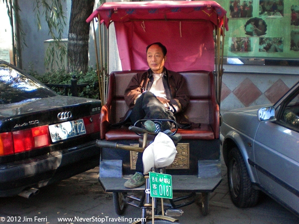 Foto Friday - a pedicab driver sitting in his cab