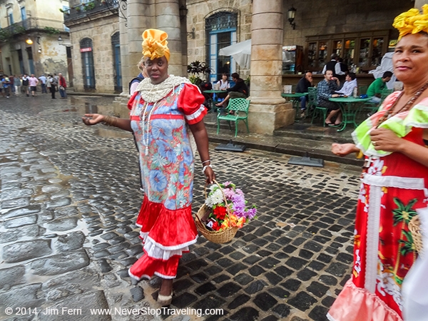 Foto Friday - 2 women in bright dresses standing in a large plaza