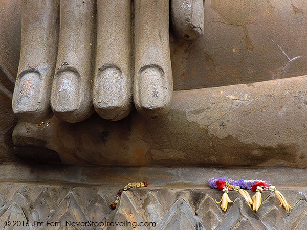 Foto Friday - large fingers of a Buddha with flowers