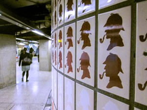 Holmes silouettes on underground station wall
