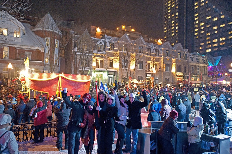 people in the snow at one of Canada's winter festivals