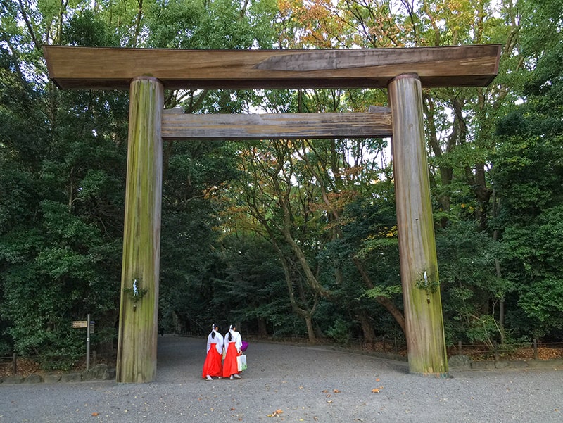 two women walking into a shrine in one of the best places in Japan