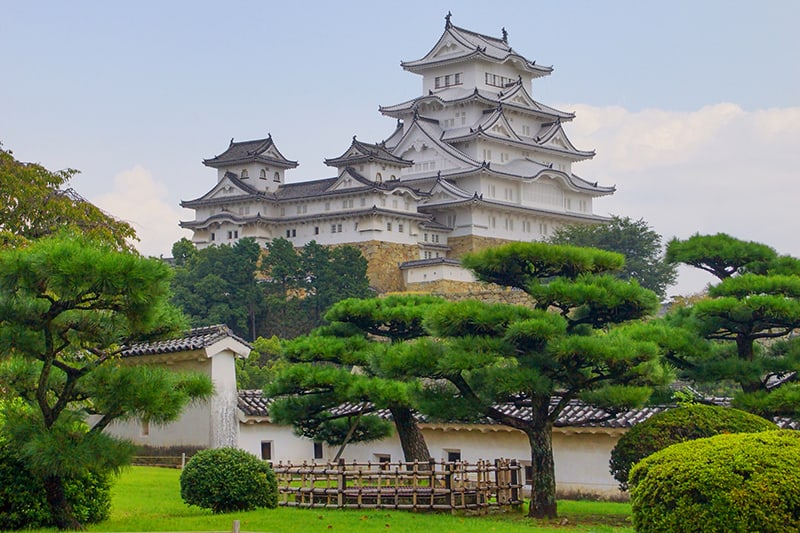 a castle on a hill in Japan