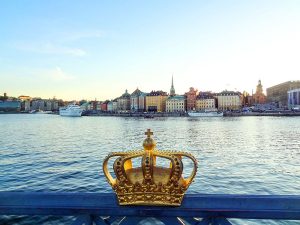 a crown on a bridge by a harbor top 10 sweden