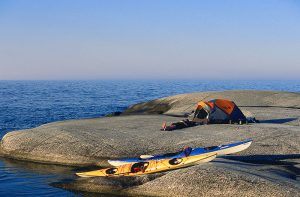 kayakers camped on a rocky island top 10 sweden