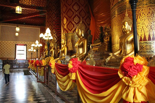 colorful drapes on Buddas in Ayuttaya - one of the Top 10 Places in Thailand
