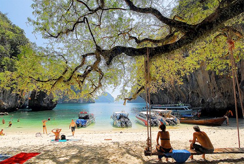 people on a beach in Krabi - one of the Top 10 Places in Thailand