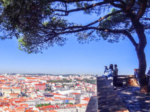 couple looking over a city in Portugal
