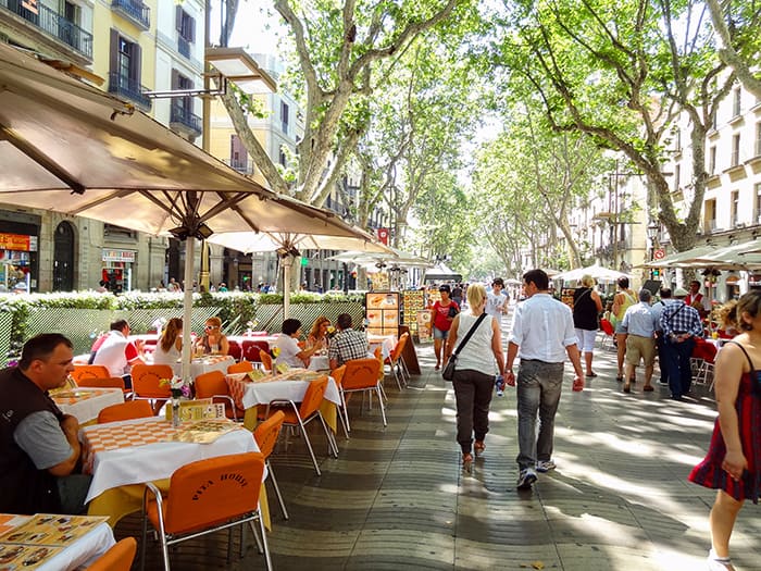 people eating at a cafe - one of the best things to do in Barcelona