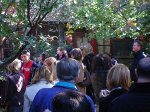 a group walking in a garden on a Beijing hutong tour