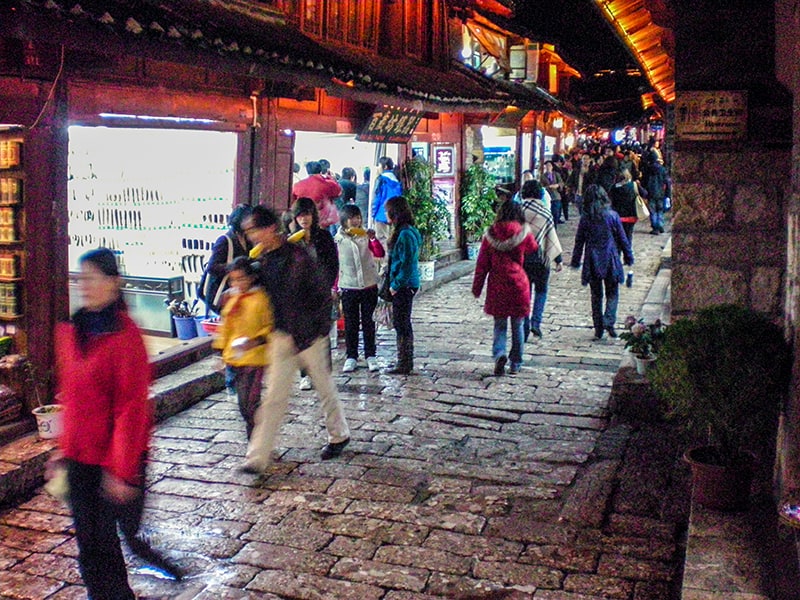 people on a street at night