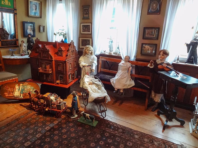 dolls and toys in a museum