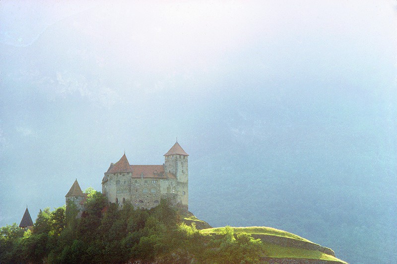 a castle on a hill in one of teh small countries of teh world