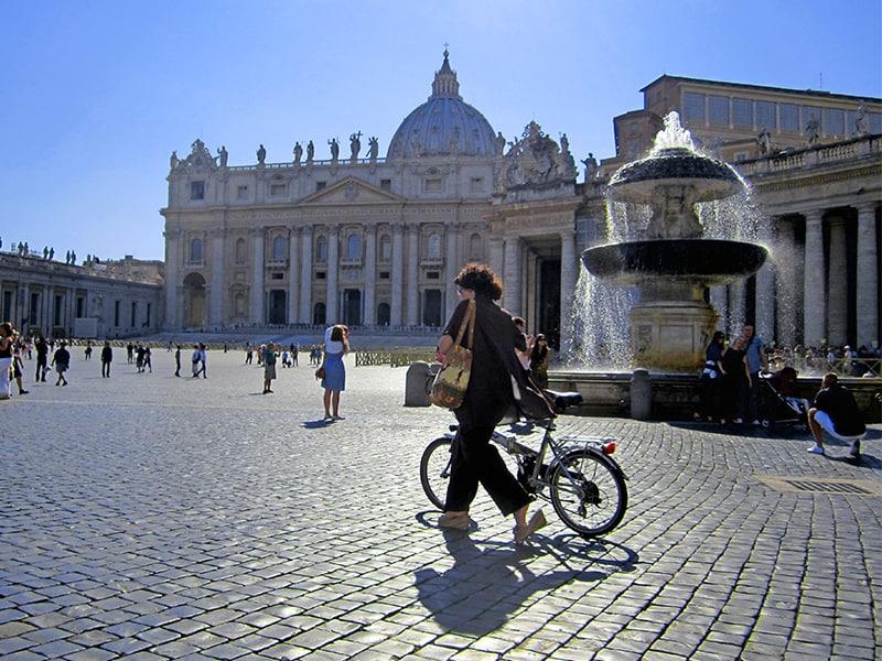 woman with a bicyle in Vatican City