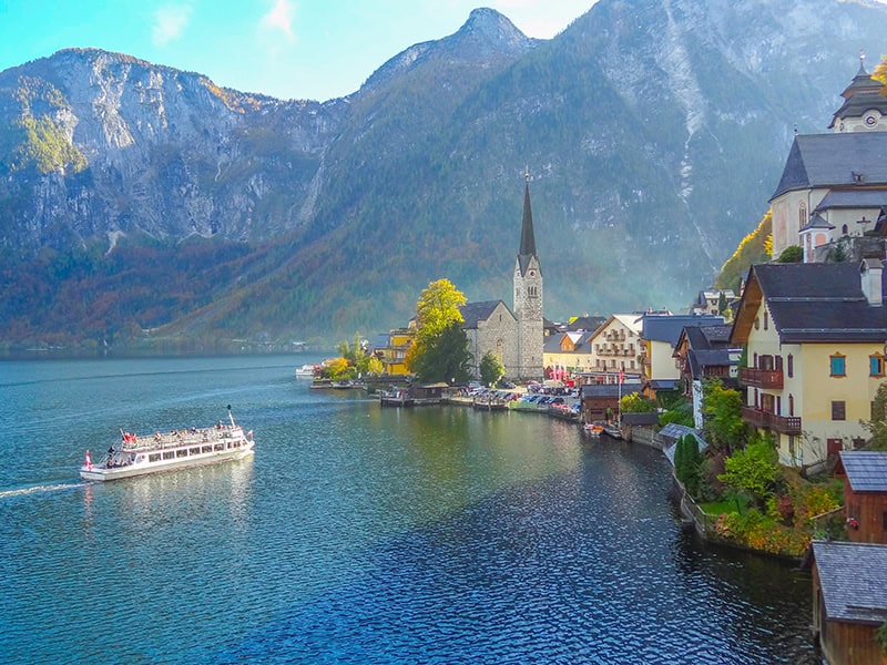a ferry approaching the town of Hallstatt