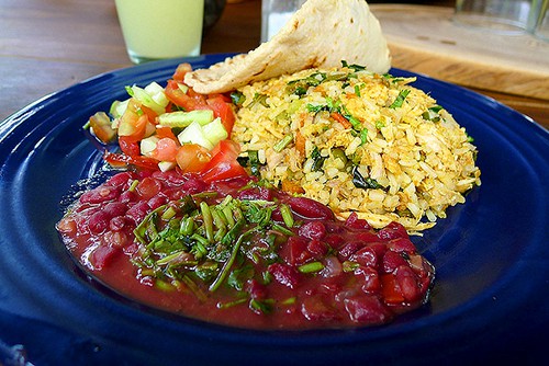 enjoying a plate of local food, one of the things to do in costa rica