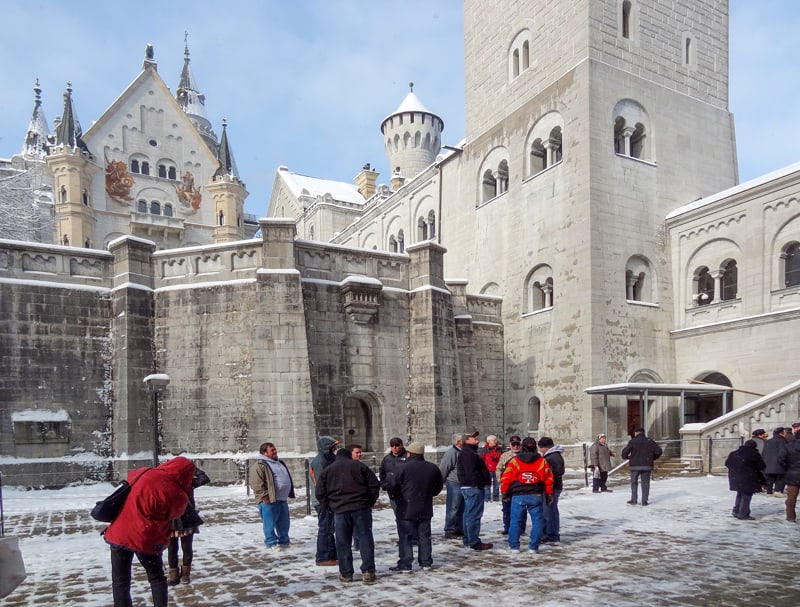 people at a castle in the snow