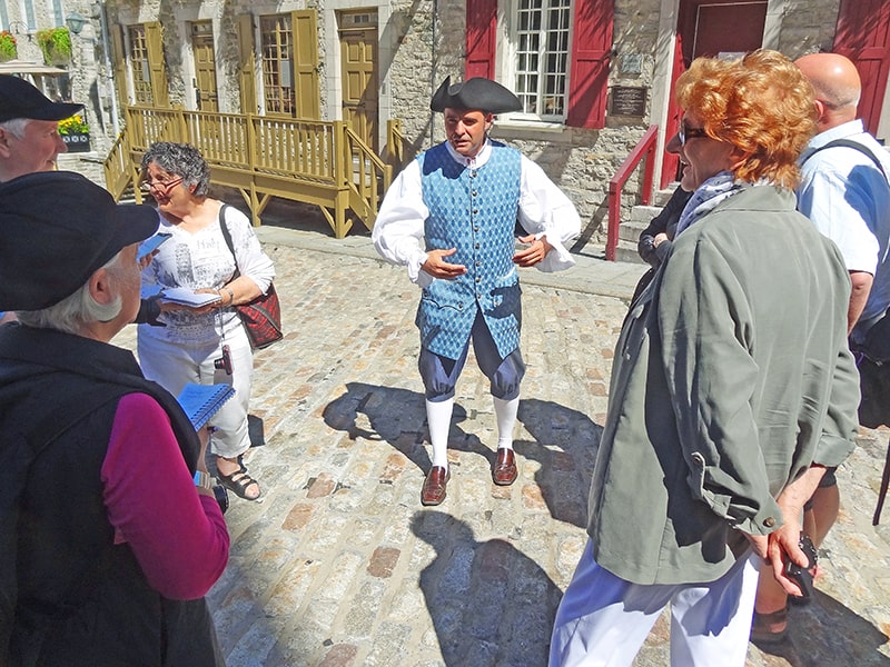 our tour guide in costume accompanying us on a walking tour of Quebec City