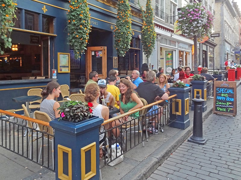 People eating a meal outside a restaurant