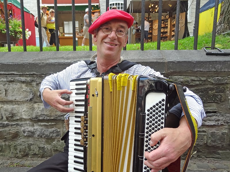 a street musician seen walking tour of Quebec City