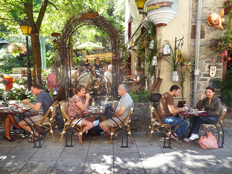 people in an outdoor restaurant seen during a walking tour of Quebec City