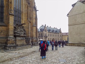 people walking in the courtyard of a castle