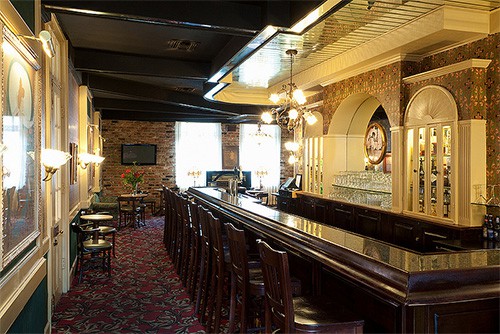 looking at an ornate bar, one of the things to do in New Orleans on a budget