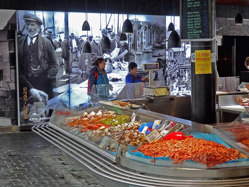 People in a fish market in Bergen, one of the things to do in Bergen, norway