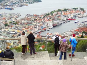people looking down on a city reached from Bergen airport