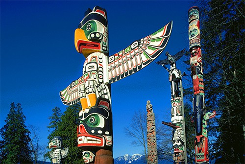 Totem poles in Stanley Park -  one of the popular places to visit in Vancouver