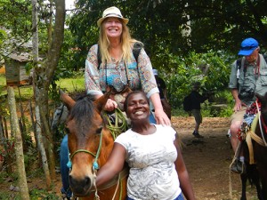 woman on horse riding to El Limon Waterfalls 