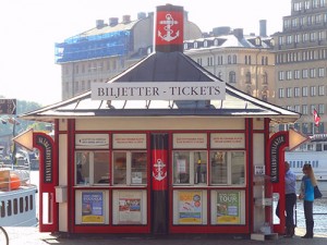 people at a ferry ticket office