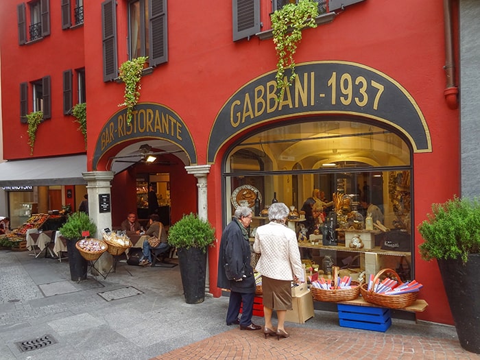 two women looking in a shop window, one of the best things to do in Lugano Switzerland