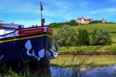 a French barge on a cruise and the countryside