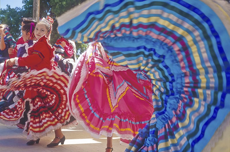 dancers in colorful skirts seen while visiting Sante Fe
