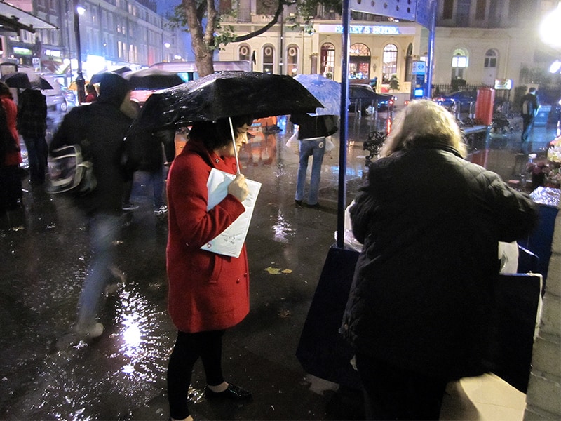 people enjoying the best things to do in London, despite the rain