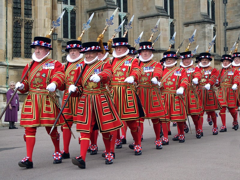 guards in red dress marching