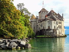 a castle on the shore of a lake