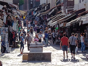 people shopping on a street, one of the things to do in Rhodes