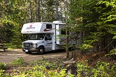 a camper parked in the woods in Québec