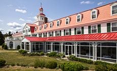 An old hotel with a red roof
