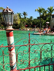 colorful lamppost by a large pool