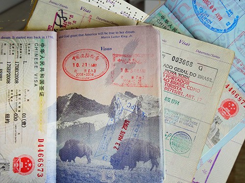a passport with visa stamps from countries requiring visas for US citizens